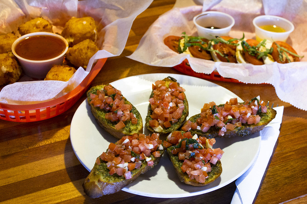 Our delicious assortment of appetizers, featuring bruschetta, fried mozzerella, and Caprese